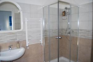 a bathroom with a glass shower and a sink at A Casa di Lidia B&B Gaeta in Gaeta