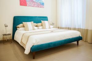 A bed or beds in a room at Palazzo Toledano