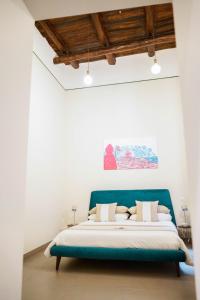 A bed or beds in a room at Palazzo Toledano