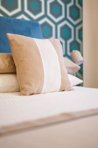 A bed or beds in a room at Palazzo Toledano