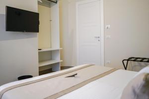 A bed or beds in a room at Palazzo Toledano