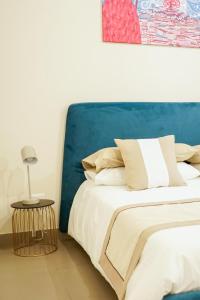 A bed or beds in a room at Palazzo Toledano
