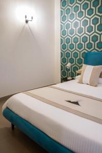 A bed or beds in a room at Palazzo Toledano