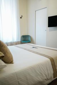 A bed or beds in a room at Palazzo Toledano
