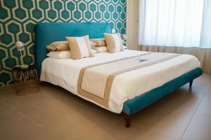 A bed or beds in a room at Palazzo Toledano
