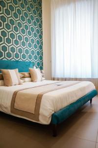 A bed or beds in a room at Palazzo Toledano
