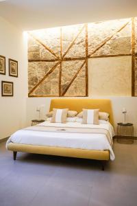 A bed or beds in a room at Palazzo Toledano