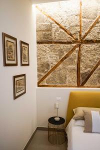 A bed or beds in a room at Palazzo Toledano