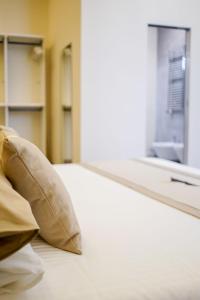 A bed or beds in a room at Palazzo Toledano