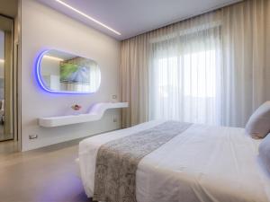 Postel nebo postele na pokoji v ubytování Hotel Nettuno