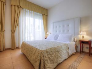 Postel nebo postele na pokoji v ubytování Hotel Nettuno