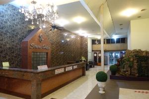 a lobby of a store with a sign on a wall at Serene Hotel in Pattaya Central