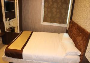Postel nebo postele na pokoji v ubytování Hotel Angina