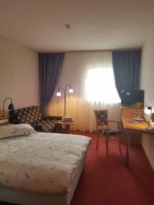 Postel nebo postele na pokoji v ubytování Iris Hotel