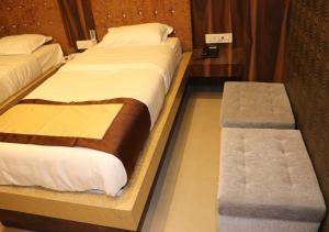 Postel nebo postele na pokoji v ubytování Hotel Angina