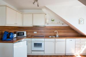 Kuchyň nebo kuchyňský kout v ubytování Gästehaus Adler