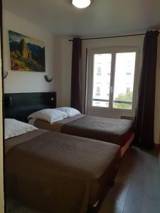 Cama o camas de una habitación en Hotel Victory