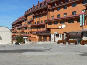 an empty parking lot in front of a large building at Guest Art Campitello Matese in San Massimo