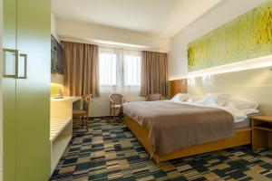 Postel nebo postele na pokoji v ubytování Hotel Continental + 37 fotografií