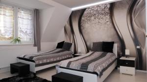 Postel nebo postele na pokoji v ubytování Apartmán Ambrosia