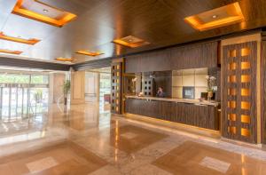 a large lobby with a bar in a building at Hotel Cordoba Center in Córdoba