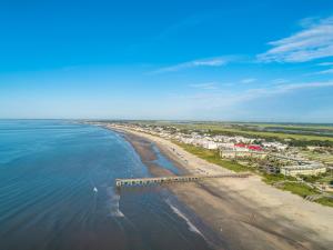 an aerial view of a beach with buildings and the ocean at The Palms Oceanfront Hotel in Isle of Palms