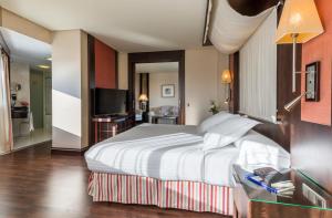 Postel nebo postele na pokoji v ubytování Hotel Cordoba Center