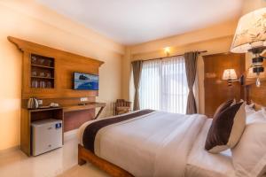 Letto o letti in una camera di Hotel Lake Shore