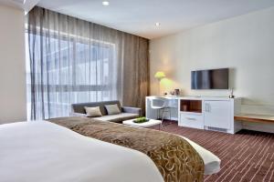 Uma cama ou camas num quarto em The George, Urban Boutique Hotel