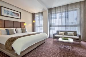 Uma cama ou camas num quarto em The George, Urban Boutique Hotel