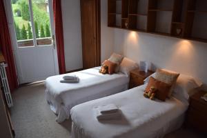 Postel nebo postele na pokoji v ubytování Hotel Sylvana