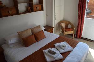 Postel nebo postele na pokoji v ubytování Hotel Sylvana