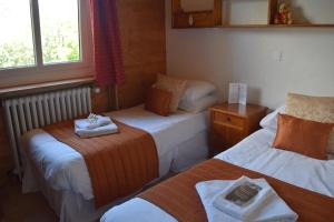 Postel nebo postele na pokoji v ubytování Hotel Sylvana