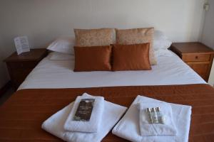 Postel nebo postele na pokoji v ubytování Hotel Sylvana