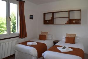 Postel nebo postele na pokoji v ubytování Hotel Sylvana