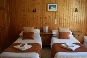 Postel nebo postele na pokoji v ubytování Hotel Sylvana