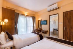 Letto o letti in una camera di Hotel Lake Shore