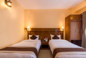 Letto o letti in una camera di Hotel Lake Shore