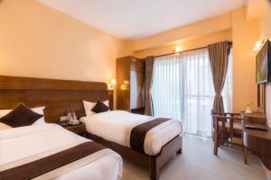 Letto o letti in una camera di Hotel Lake Shore