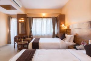 Letto o letti in una camera di Hotel Lake Shore