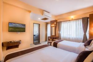 Letto o letti in una camera di Hotel Lake Shore