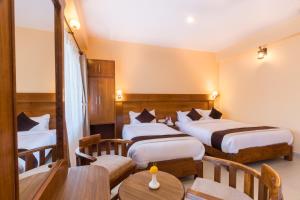 Letto o letti in una camera di Hotel Lake Shore