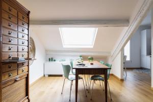 a dining room with a table and chairs at SPAZIO M&M Via Augusto Anfossi 10 in Milan