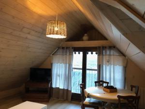 a dining room with a table and a window at Casa Rey in Vilac