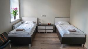 Postel nebo postele na pokoji v ubytování Bella Riga Hotel with Self-Check in