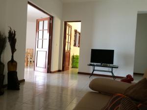 TV a/nebo společenská místnost v ubytování Vannilla Residencial
