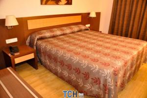 Postel nebo postele na pokoji v ubytování TCH Hotel