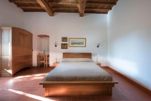 Ένα ή περισσότερα κρεβάτια σε δωμάτιο στο Torre nel Chianti