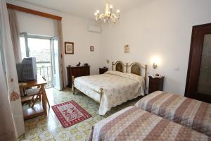 Ένα ή περισσότερα κρεβάτια σε δωμάτιο στο Casa Vacanze S.Angelo La Stella