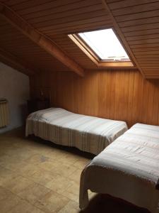A bed or beds in a room at La Via Francigena